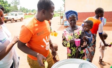 Sylvie is fed fortified porridge in a Concern clinic