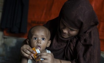 Arshia feeds her son Kassim