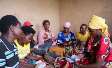 Bernadette Katungu Kamatogha (center right, in pink head scarf) with her local VSLA. Photo: Eugene Ikua / Concern Worldwide