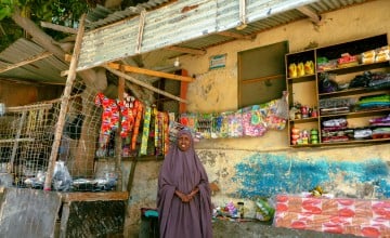 Mako Saney outside of her shop in Mogadishu. She was able to set up a thriving business after participating in a Concern-led Self-Help Group and livelihoods trainings. Photo: Adnan Mohamed/Concern Worldwide