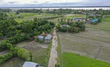 A four-foot-high, 2,241-foot-long flood-resilient road now bridges the east and west of Vati Kapasia, Bangladesh. The raised road, a lifeline for the local community, was constructed in July 2024 by Gana Unnayan Kendra with support from Concern Worldwide and funded by the Z Zurich Foundation”. Photo: Saikat Mojumder/Concern Worldwide