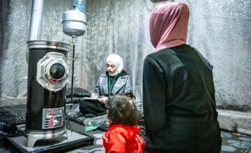 Concern Compliance Officer interviews a mother from Syria and now lives in Northern Lebanon. Photo: Gianluca Galli/Concern Worldwide.