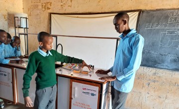 Grade 8 boys from Turbi Junior School take part in a hands-on practical session during their integrated science class. Photo: Concern Worldwide