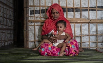 Rafika* (25) feeds her child Laila* (10 months) RUTF. Laila* is currently suffering from severe acute malnutrition (SAM) and is receiving treatment through the Outpatient Therapeutic Feeding Program (OTP) run by Concern Worldwide. As part of this program, children with SAM but without complications are provided with Ready-to-Use Therapeutic Food (RUTF), a specialised, nutrient-rich paste designed to address their immediate nutritional needs. The OTP offers a critical lifeline, providing tailored care and th