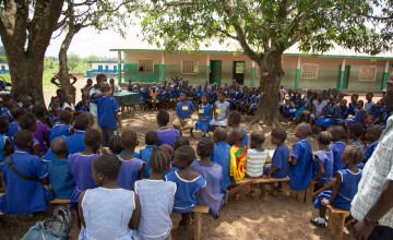 Students at UMC Primary School Masengbeh watch as their peers perform a play about gender as part of a school club, Masengbeh, Tonkolili, Sierra Leone. Photo: Michael Duff.