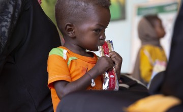 Jamal eats therapeutic food at a nutrition clinic, supported by Concern Worldwide, in Ardamata, just outside El Geneina, Sudan. Jamal* is severely acutely malnourished.