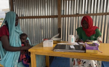 Khadidja* listens to Concern staff at the health clinic