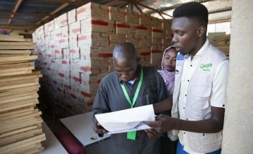 Members of Concern's Nutrition Team in El Geneina, West Darfur, collect supplies of RUTF from the Concern warehouse for delivery to health centres. Photo: Kieran McConville/Concern Worldwide