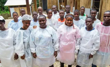Staff at a Concern-supported Ebola clinic in Liberia. The clinic was built to triage patients during the outbreak. After the epidemic was over, it was converted into a basic health center. Photo: Kieran McConville