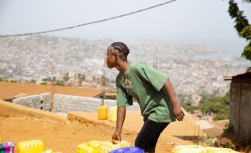 Tree Planting is an informal community overlooking Freetown in Sierra Leone. Access to clean water has been a challenge, but a partnership with Concern has resulted in a new solar-powered water system, which is managed by a locally-elected committee. Photo: Kieran McConville/Concern Worldwide