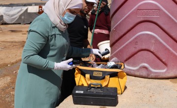 Water quality is tested in Twaihina Camp, Al-Tabqa in Syria. Photo: Concern Worldwide