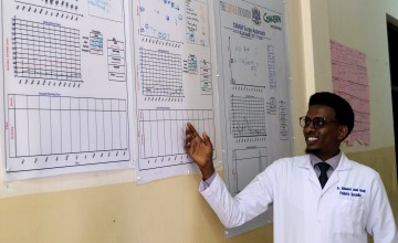 Dr. Muhammad Dek Jama points to the Surge data at Banadir Hospital. Photo: Hugh Golden/Concern Worldwide