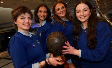 Four people from Ursuline Secondary School holding a trophy after winning Concern Debate final 2026