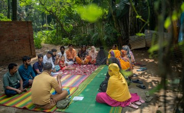 A self-help group meeting in Mirpur led by Graduation mentor Sajeul Islam. This meeting is focused on educating members amid a growing dengue outbreak. This is one of 76 groups under Concern Bangladesh's Green Graduation Programme. Photo: Mumit M/Concern Worldwide
