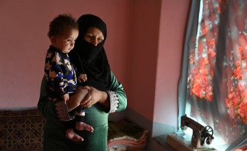 Malalai* holds her son Hafez*. Despite a difficult birth and ongoing complications, he has been recovering through a Concern-supported clinic near the family's home in Noor Aba. Photo: Nava Jamshidi/Concern Worldwide