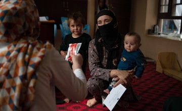 Tahira* receives therapeutic food for her seven-month-old son Faris*'s malnutrition. Faris has been treated at a Concern-supported Family Health House. Photo: Nava Jamshidi/Concern Worldwide