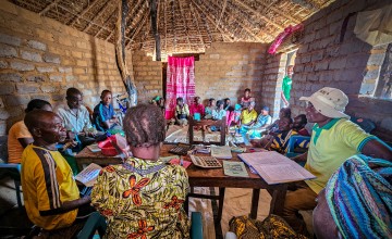Participants in Concern DRC's Green Graduation programme attend a meeting of their Village Savings and Loan Association (VSLA) in Kabanda, Kabalo Territory, Tanganyika. Photo: Concern Worldwide