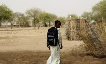 Oumar, returning home after classes. Photo: Kouakaine Moundi/Concern Worldwide.