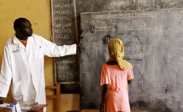 Teacher Madjitan and student Halimé in the classroom at Estrena Centre school. Photo: Kouakaine Moundi/Concern Worldwide.