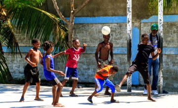 Children play in the Foyer Culturel du Mexique in the outskirts of Cité Soleil, a sprawling marginalised community of some 400,000 people where it’s international aid groups and local NGOs providing the majority of basic services, such as water, electricity, and education. Photo: Tim Sheehan/Concern Worldwide