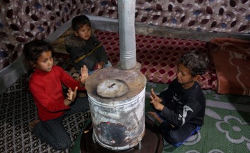 Three of Samira*'s children. Samira, her husband and eight children live in a camp in Menbij, eastern rural Aleppo.
