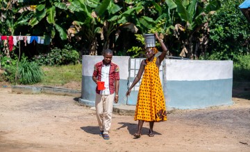 Issa K. Conteh and Agnes G. Sesay at the community water pump