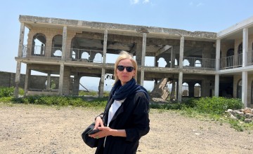 Journalist Orla Guerin standing outside an abandoned building in Taiz, Yemen