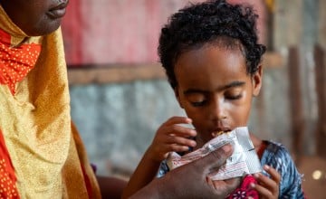 Calaso's child eating RUTF