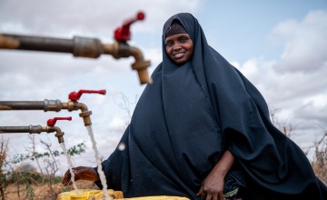 Local farmer Luul Ahmed collecting water at Bula Qalooc, Dolow District, Gedo region, southwestern Somalia