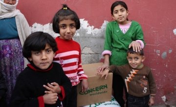 Young Syrian children pictured with supplies from Concern.