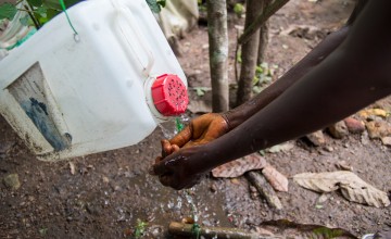 A tippy-tap in action in the village of Dokoizia in Lofa county, Liberia. Photograph taken by: Kieran McConvillle/Concern Worldwide.