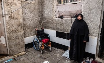 Leena (47) stands outside her rented accommodation in Turkey. Photographer: Kevin Carroll/Concern Worldwide.