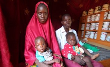The Hassane family sit in their small house. Baby loubaba is severely malnourished and is attending a Concern Worldwide supported health centre in Commune de Bambaye, Tahoua, Niger for treatment. Photo: Jennifer Nolan / Concern Worldwide.