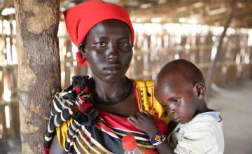 Khadra* and her two year old daughter, Jamilah*, being screened by staff of Nile Hope, a South Sudanese NGO being supported by Concern Worldwide. Photo: Kieran McConville/Concern Worldwide. *name changed for security reasons.