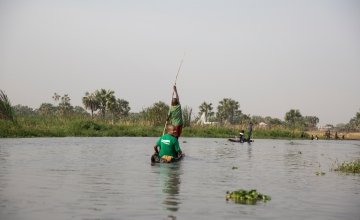 Concern South Sudan emergency nutritionist, *Abhsir travels through the swamps of Unity State by dugout canoe.March 2017. Photo by Kieran McConville, Concern Worldwide.