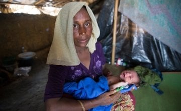 Shaju (name changed for security) with her day-old daughter in her shelter at Moynardhona refugee camp, Cox's Bazar. She says: &quot;In Myanmar there was killing and fighting - here there is peace.&quot; Photo: Kieran McConville/Concern Worldwide.