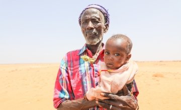 Atho Shama (78) with his five month old son Adano. His wife Iyesa is severely malnourished, weighing only 32kgs and complaining of headaches and fever. Photo: Jennifer K Nolan / Concern Worldwide, Feb 2017.