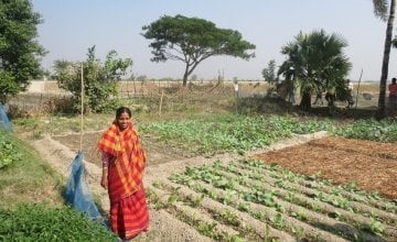 Varoti Rani stands in front of her vegetable plot. Through the costal resilience programme, she has received seeds and she is learning new techniques to help her grow a range of nutritious crops in Khulna, Bangladesh Photo: Hee Young Park /Concern Worldwide, December 2016