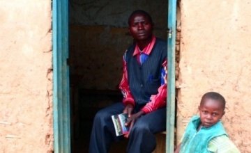 Teacher Bitwaki Ntezi sits inside his home in Kazinga Village, Democratic Republic of Congo Photo taken by Concern Worldwide.