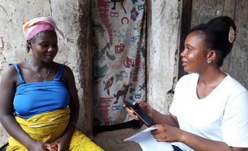 Data collector, Mariama Kamara, completing a household survey in Tonkolili district. Photo: Carlos Velazquez / Concern Worldwide