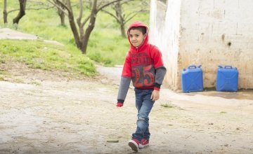 Kareem* walking to Concern’s non-formal education learning centre near his home in northern Lebanon. Photo: Chantale Fahmi/Concern Worldwide 2017.