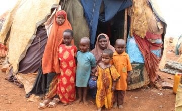Khadra* with five of her seven children outside their makeshift house in an IDP camp in Somalia. Photo: Alinur Ali Mohamed/ Concern Worldwide