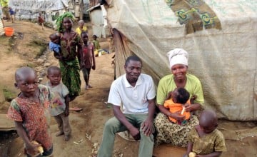 Edmond Matembe and his wife in front of their hut in Kilmani camp. Photo by Silvia de Faveri/Concern Worldwide.