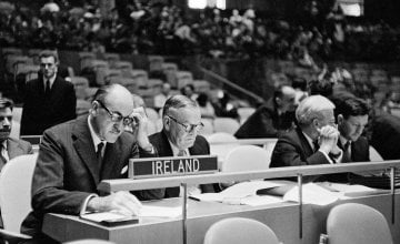 Frank Aiken, Ireland's Minister for External Affairs, and Chairman of the Delegation of Ireland to the General Assembly (left), at his country's desk, with Mr. Frederick H. Boland, Permanent Representative of Ireland to the U.N., photographed prior to the opening of the afternoon meeting of the Assembly in September 1957. Photo: UN Photo Library.