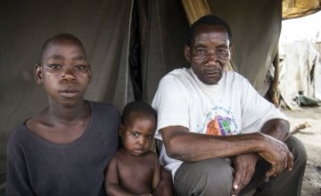 Saide in Namacurra with his children after the flood in his district of Zambezia, Mozambique. Photo taken by Crystal Wells/Concern Worldwide
