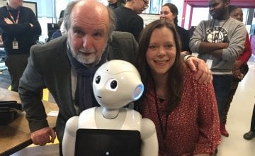 Michael Doorly and Ellen Ward of Concern meeting Pepper the Robot in Accenture's Dock building in Dublin. Photo: Concern Worldwide