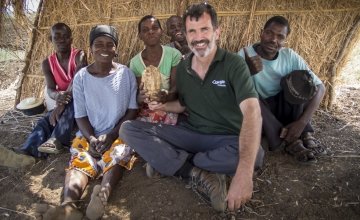 Kieran McConville of Concern Worldwide with a group of farmers who grow orange-fleshed sweet potato in Nsanje, Malawi. Photo: Concern Worldwide.