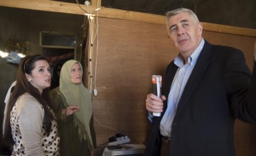 Concern Worldwide CEO, Dominic MacSorley, talks with residents of a collective centre for Syrian refugees in northern Lebanon. Photo taken by Kieran McConville/Concern Worldwide.