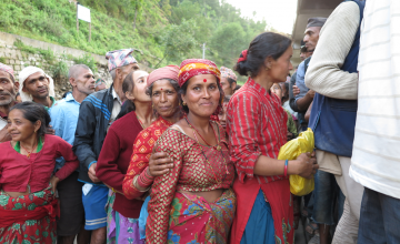 Villagers queue for relief items in the Sindhupalchok District. Photo taken by Andrea Barrueto. 