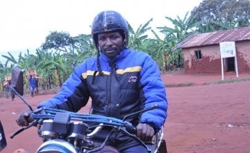 Bernard Kamuhanda, a volunteer in agricultural development, on his motorcycle taxi in Nterwenge, Tanzania. Photo taken by Concern Worldwide.